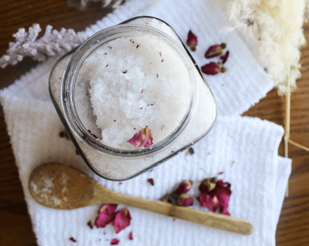 DIY Bath Salts for Muscle Relief and Relaxation (with Lavender & Epsom Salt) Glass jar filled with homemade lavender bath salts without rose petals on top