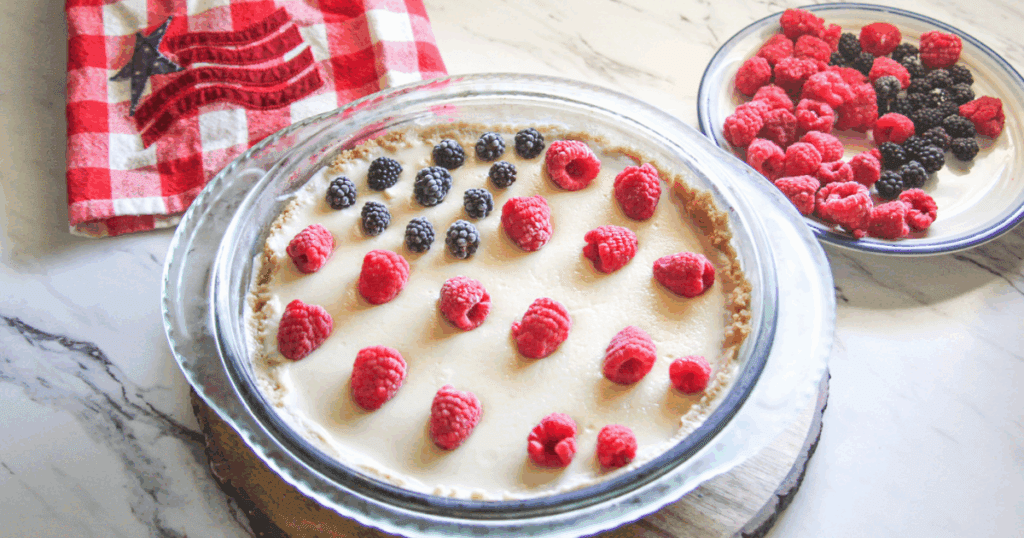 Side view of whole 4th of July Pie showing pudding, crust, and berries