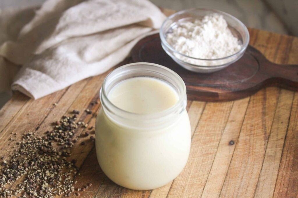 Homemade cream of chicken soup stored in a glass jar