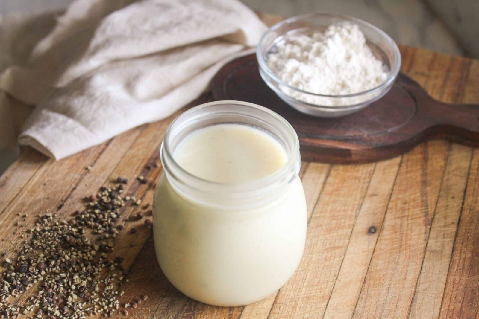 Homemade cream of chicken soup stored in a glass jar