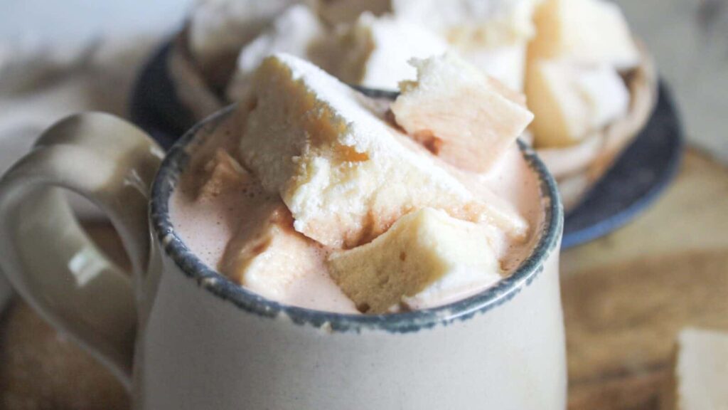 Homemade marshmallows floating in a mug of hot chocolate