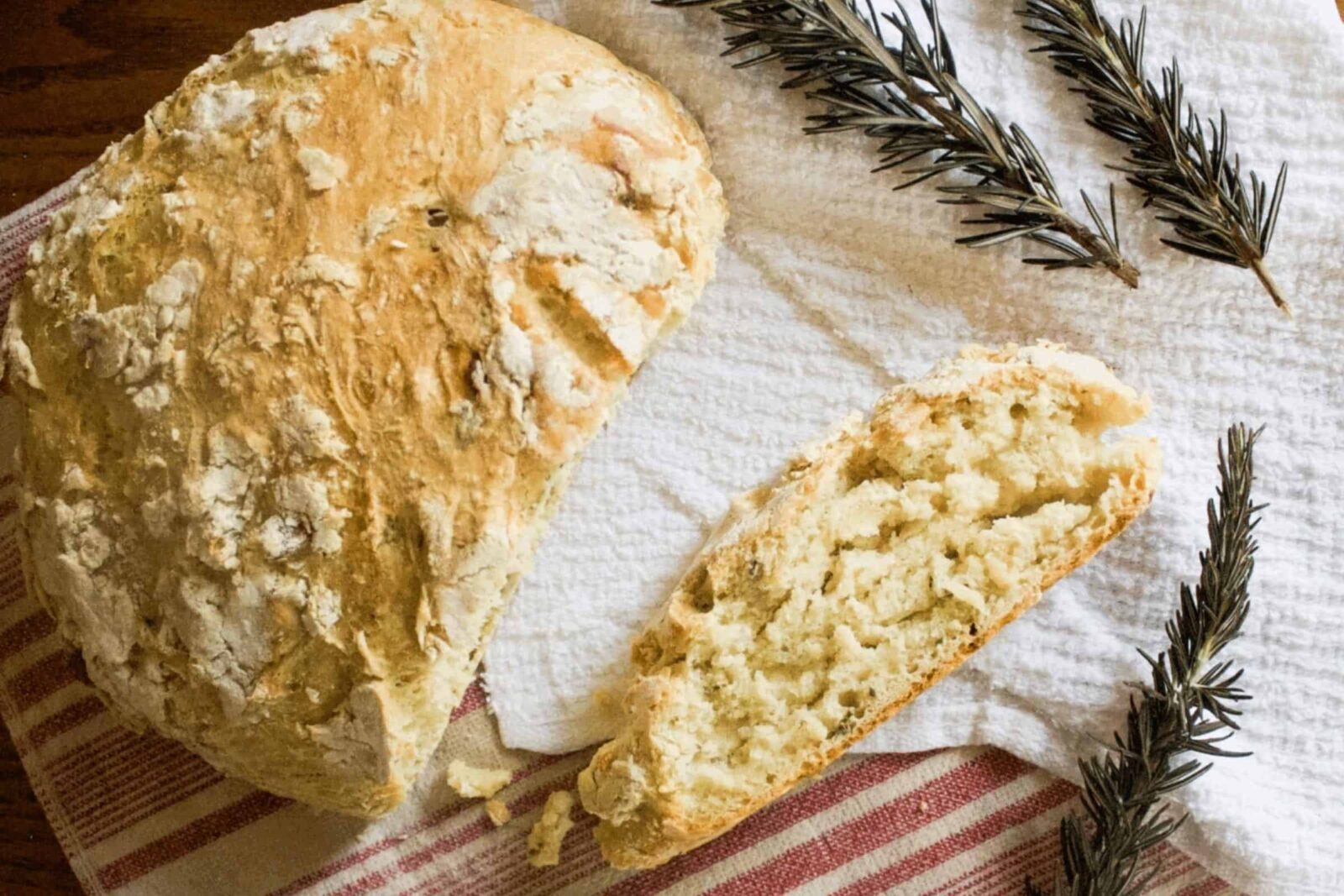 Sliced no-knead artisan bread showing soft crumb and crispy crust.