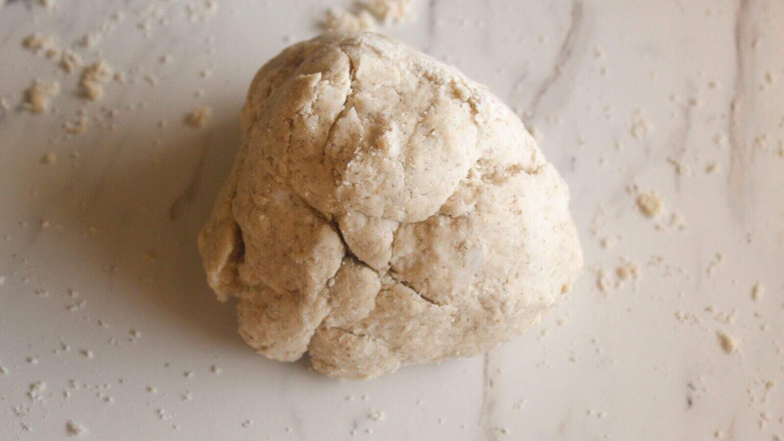 Ball of lard pie dough ready to be rolled out for a pie crust