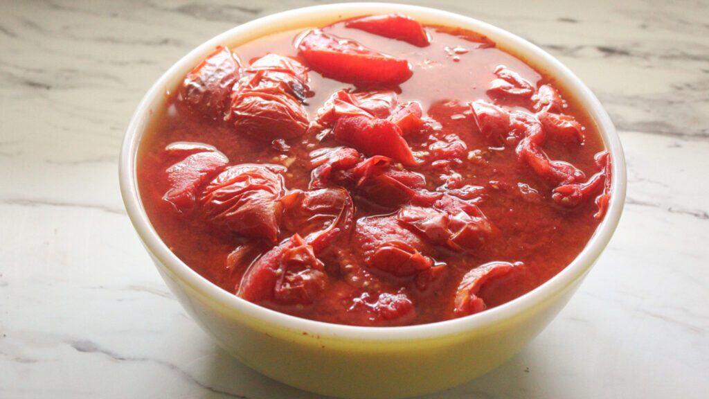 Bowl of freshly roasted tomatoes ready for making tomato sauce