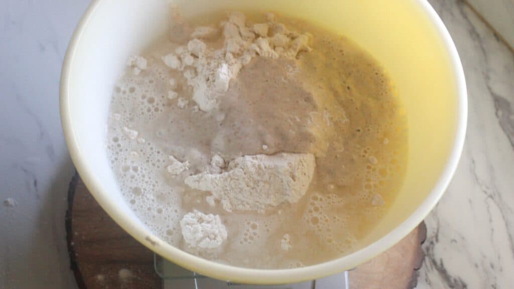 Same Day Sourdough Bread Ingredients for same day sourdough bread in a mixing bowl before combining.