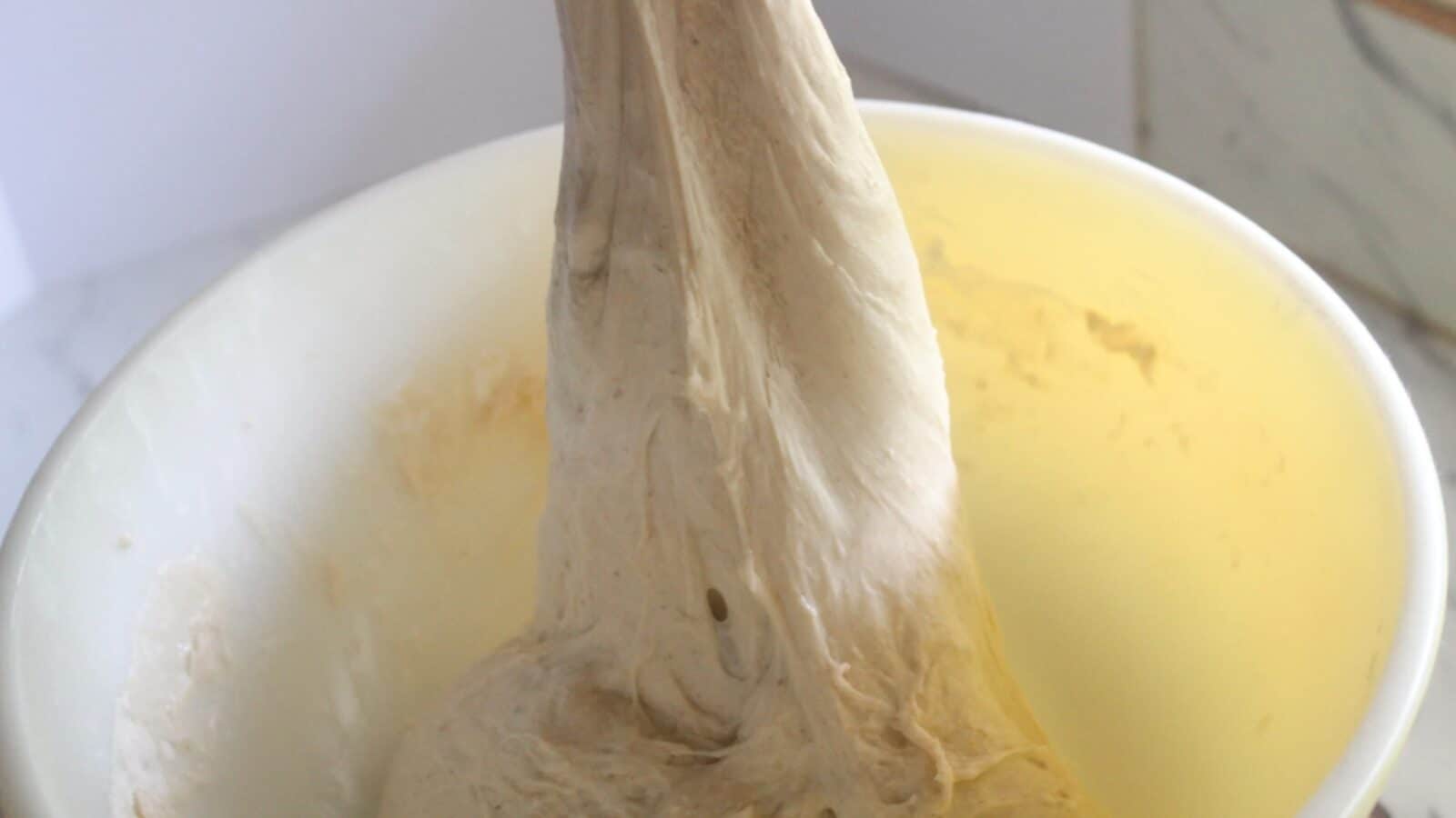 Same Day Sourdough Bread Stretch and fold technique for sourdough dough in a mixing bowl.