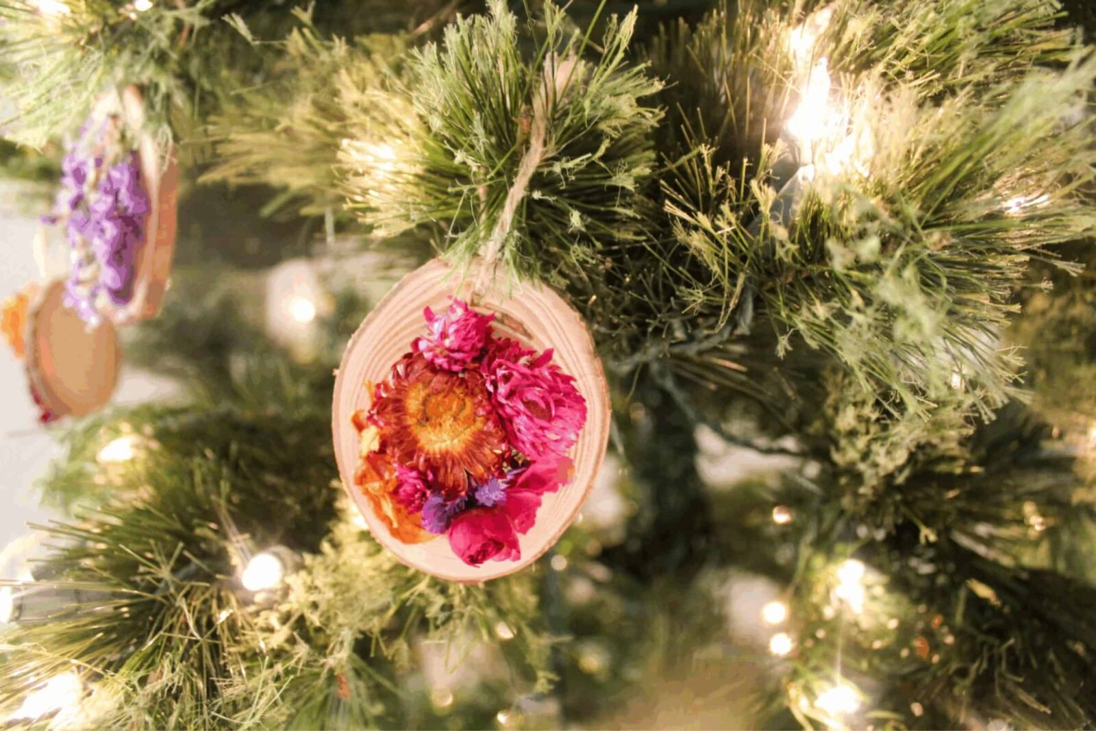 Wood slice Christmas ornaments decorated with dried flowers, rustic holiday decor