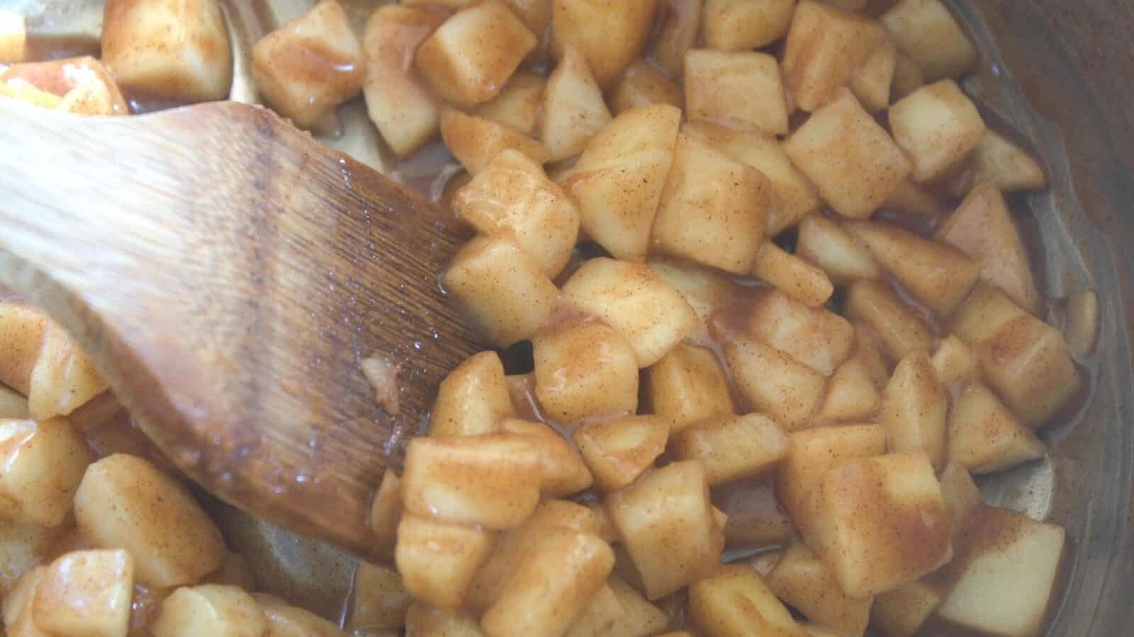 Apple Pie Cinnamon Rolls Skillet of diced apples cooked with honey, cinnamon, and nutmeg.