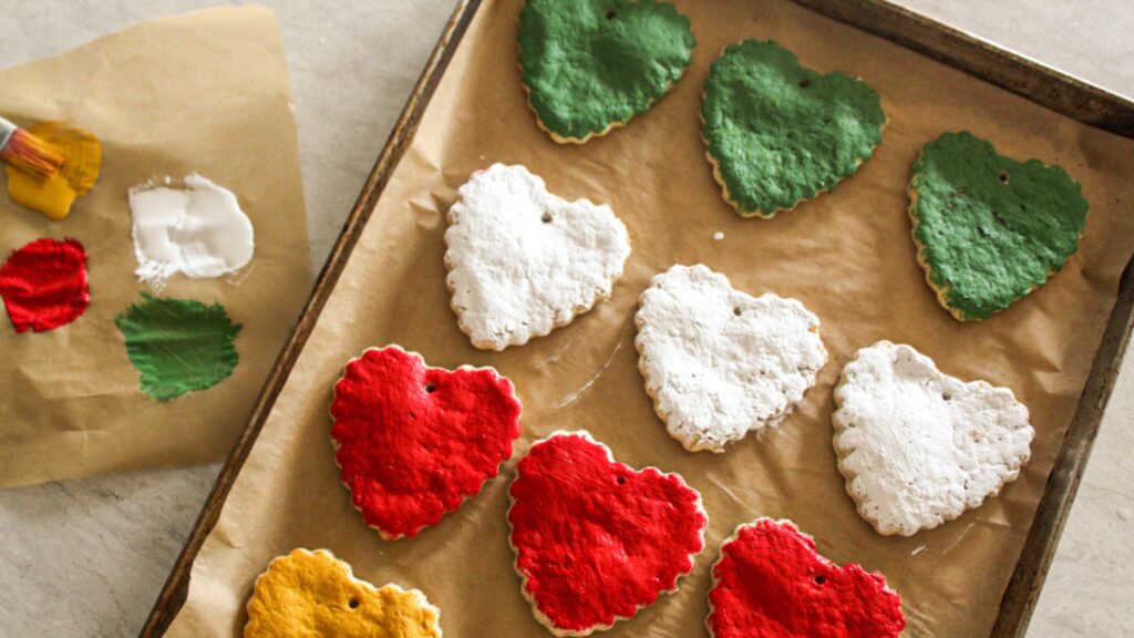 Rustic salt dough ornaments shaped like hearts tied with twine.