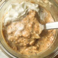 Close-up of creamy pumpkin overnight oats showing oats, pumpkin puree, and spices