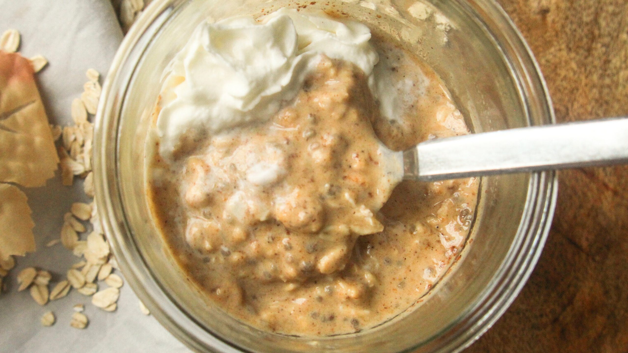 Close-up of creamy pumpkin overnight oats showing oats, pumpkin puree, and spices