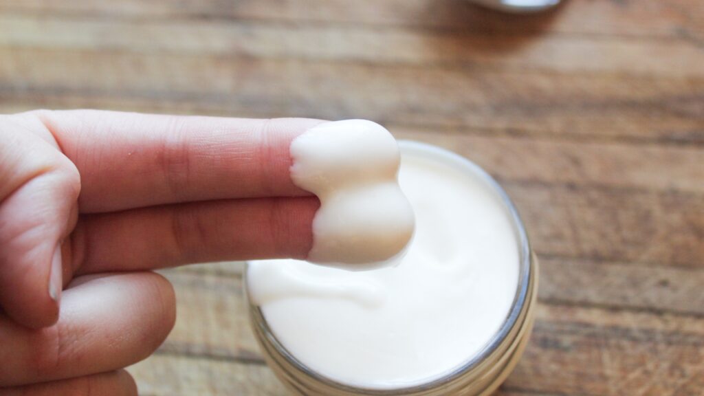 Jar of whipped tallow balm with a creamy texture.