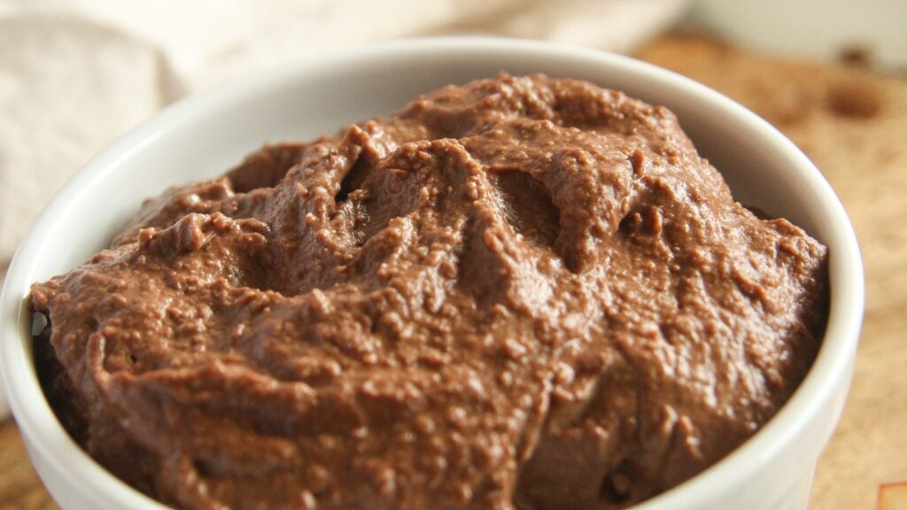 Close-up of creamy chocolate hummus texture in a spoon