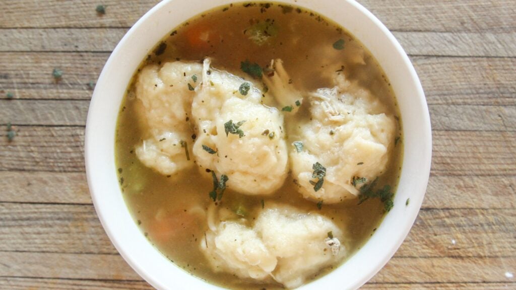 Hot, cooked healthy chicken and dumplings soup in a bowl