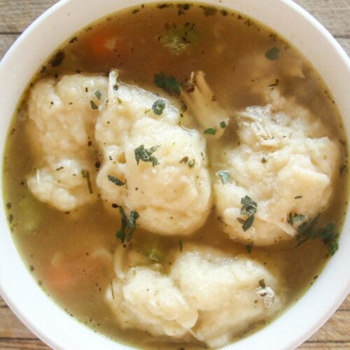 Hot, cooked healthy chicken and dumplings soup in a bowl
