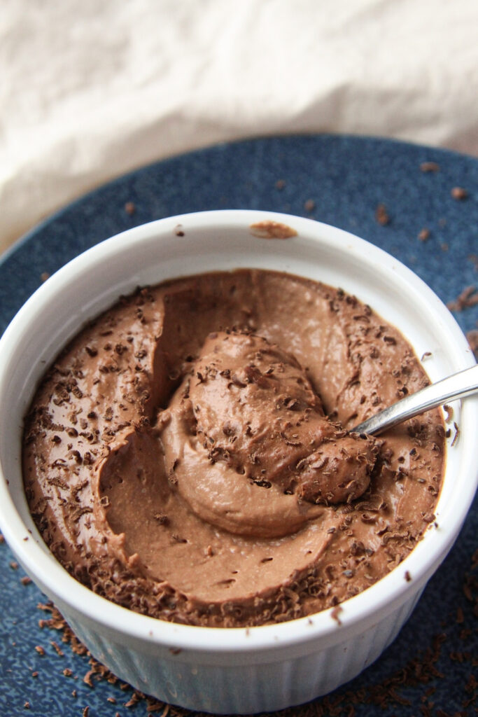 Close-up of scoopable cauliflower chocolate mousse in a ramekin
