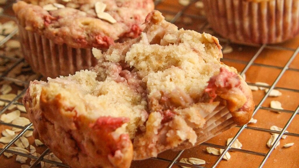 Extreme close up of the interior of a dairy-free strawberry oat muffin.